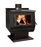 A black Blaze King KE40 King wood stove with a visible fire through the glass door, showing a large and deep firebox.