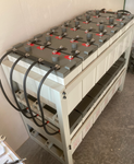 Rows of Valiant 2 Volt batteries on a stand with Cables and Busbars
